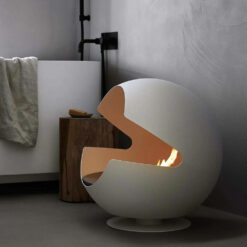 Cheminée biothanol à poser au sol Vauni Glove vu de profil dans une ambiance claire