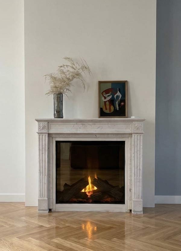 Cheminée décorative en pierre avec son foyer électrique